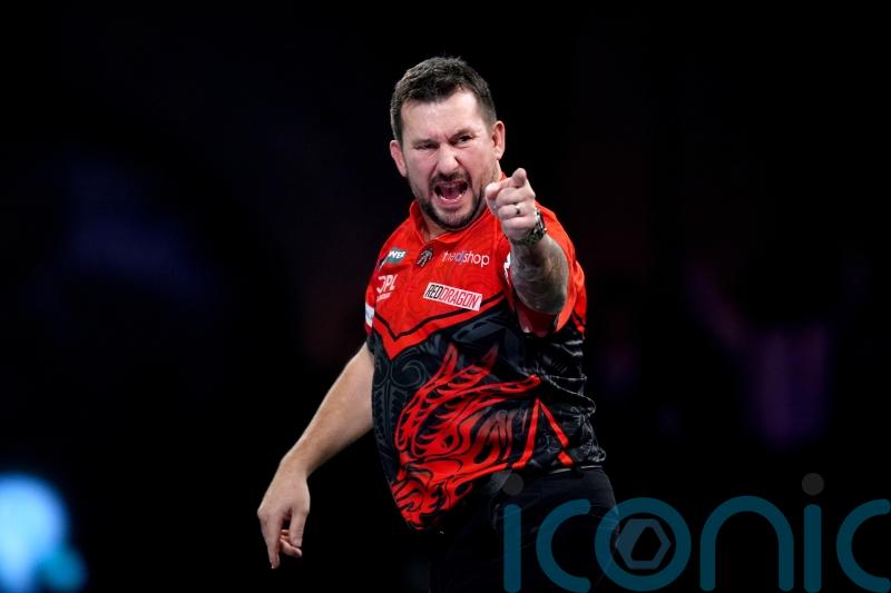 Jonny Clayton edges Mickey Mansell in epic round-two contest at Alexandra Palace