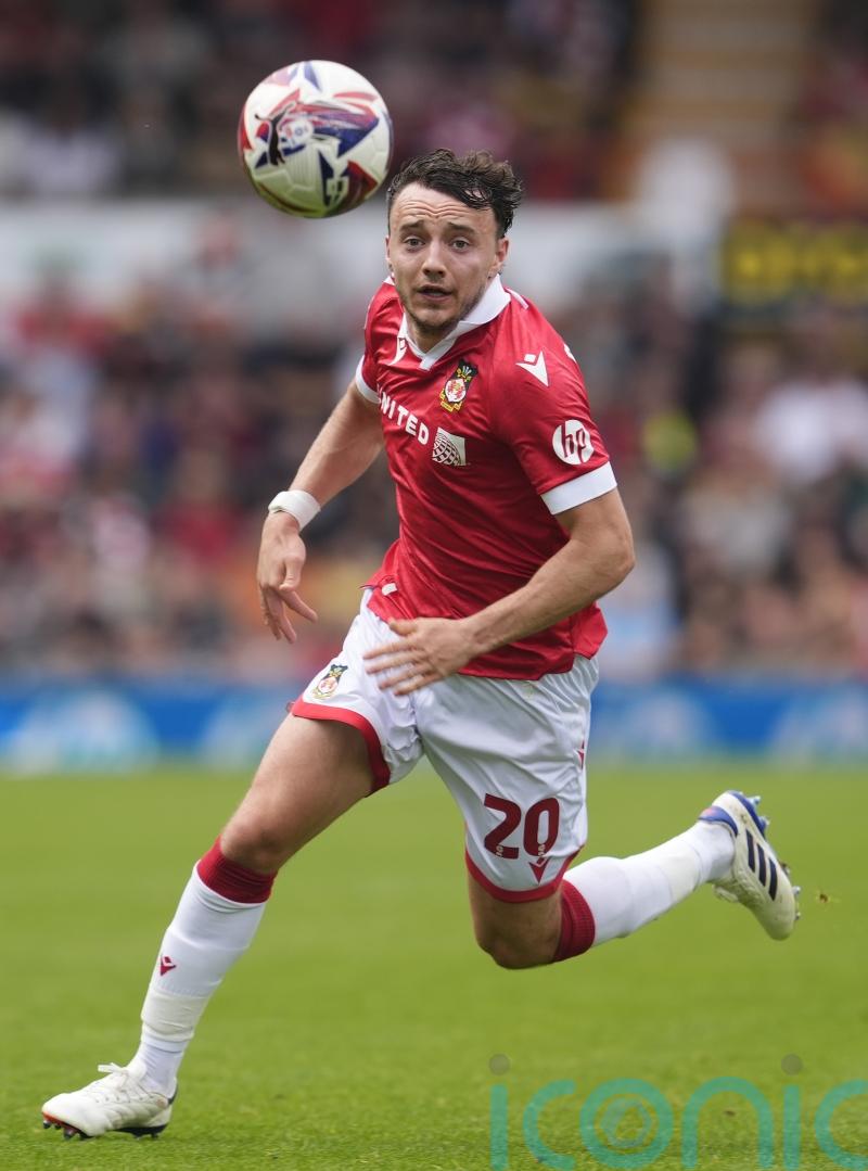 Wrexham win at Northampton to maintain promotion hopes