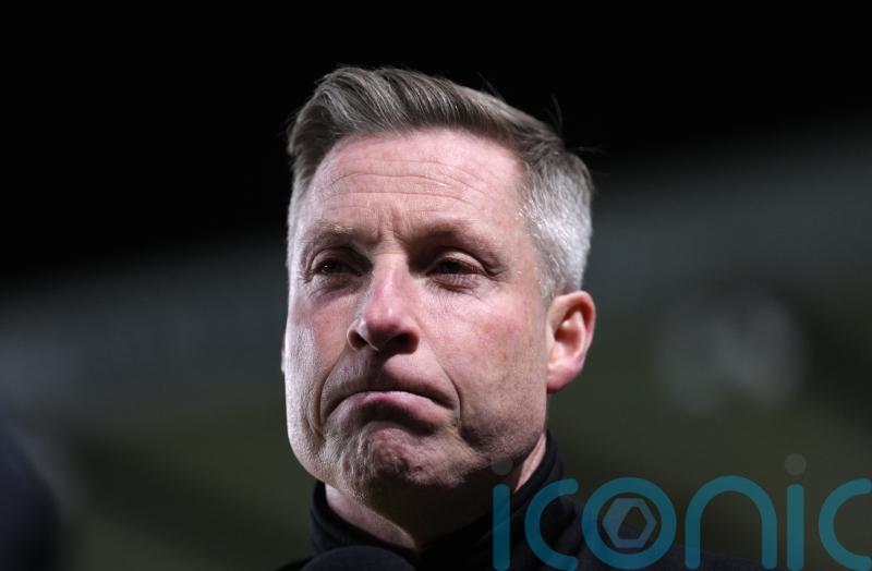 Cambridge boss Neil Harris deflated by home loss to Peterborough