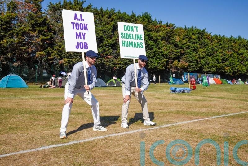 Uniformed protesters criticise introduction of AI line calls at Wimbledon