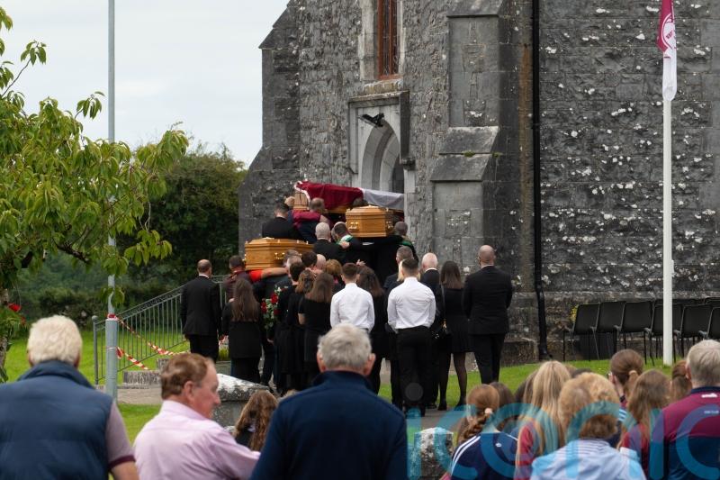 Crowds turn out to say final farewell to murdered mother and her children